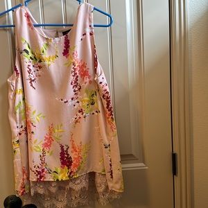 Woman’s sleeveless blouse with lace on the hem.